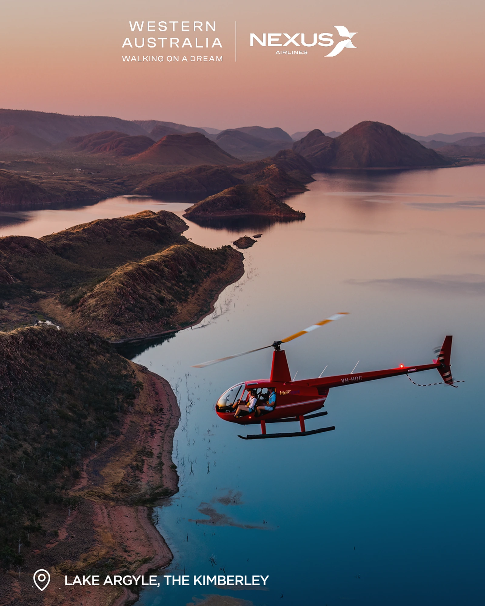 Red helicopter flying over dramatic Kimberley landscape with rugged red rock formations and water — Nexus Airlines social media carousel slide