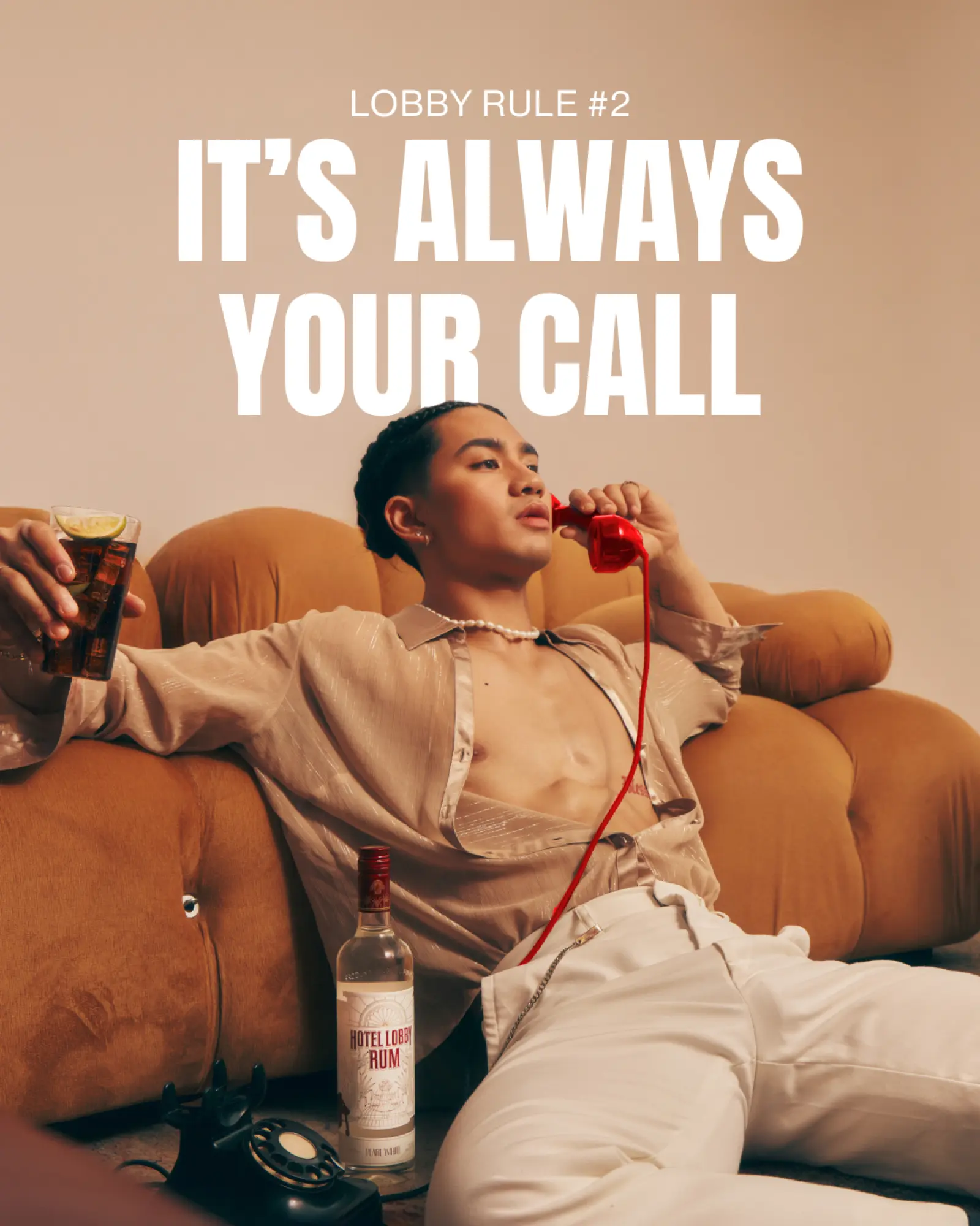 Hotel Lobby Rum — 'It's Always Your Call' with person lounging on a sofa holding a drink