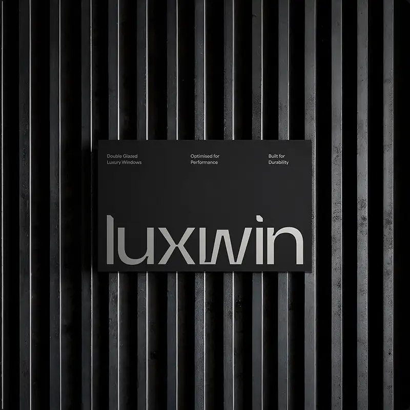 The Luxwin brand name displayed on a business card against a dark background with vertical ribbed texture — Luxwin brand card