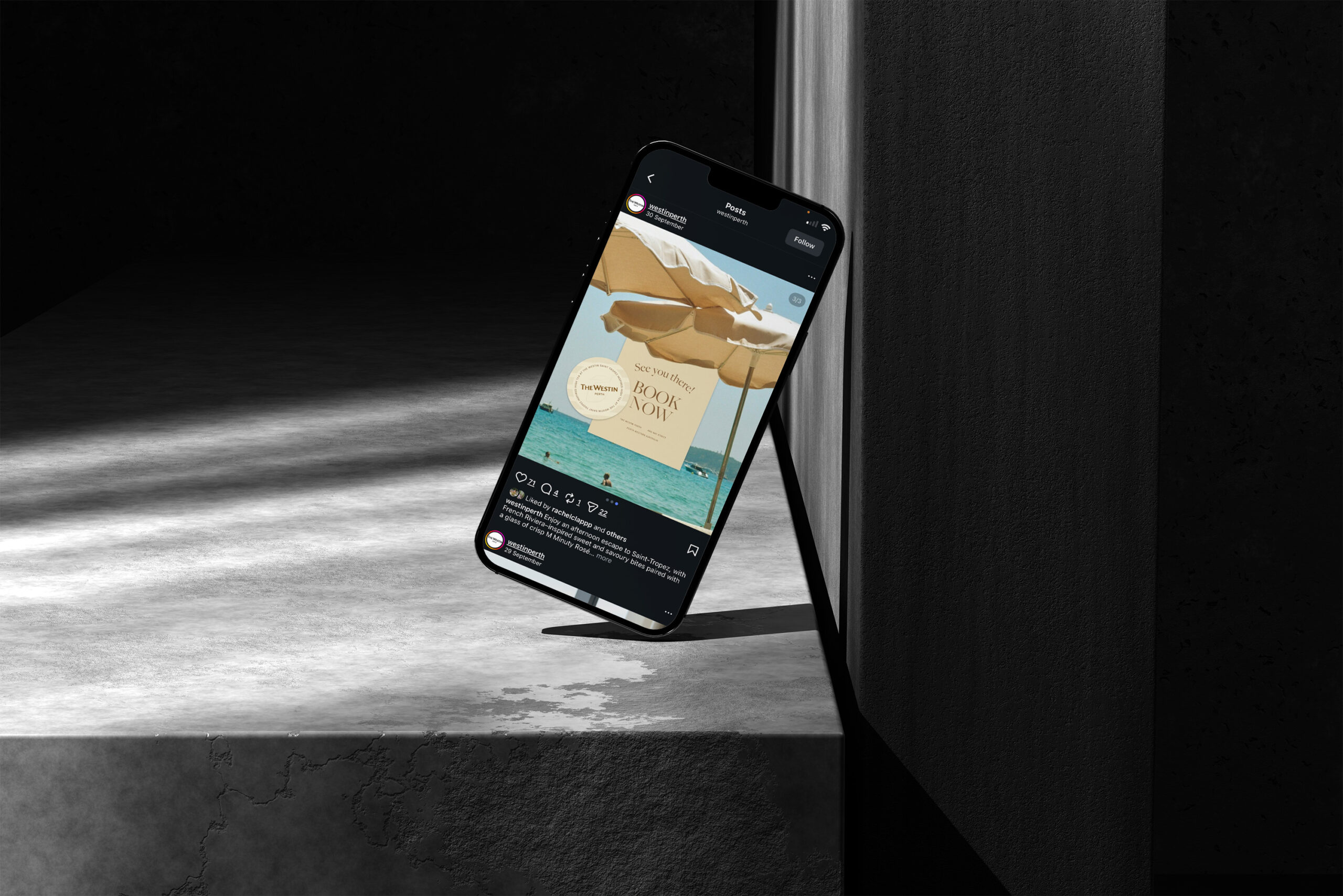 Smartphone displayed at an angle on a dark surface with a lit screen