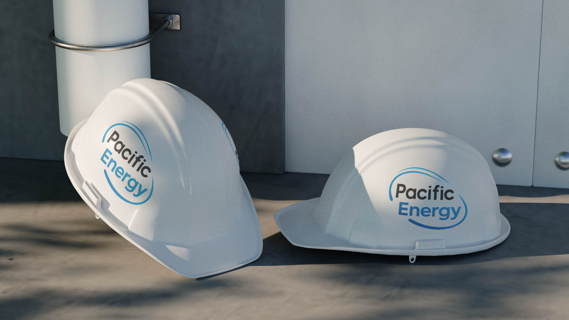 Two Pacific Energy branded white hard hats on a light surface