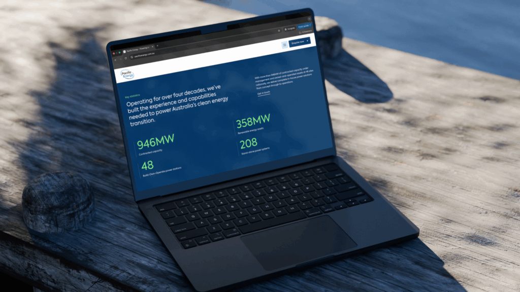 MacBook laptop showing a Pacific Energy digital dashboard or website design