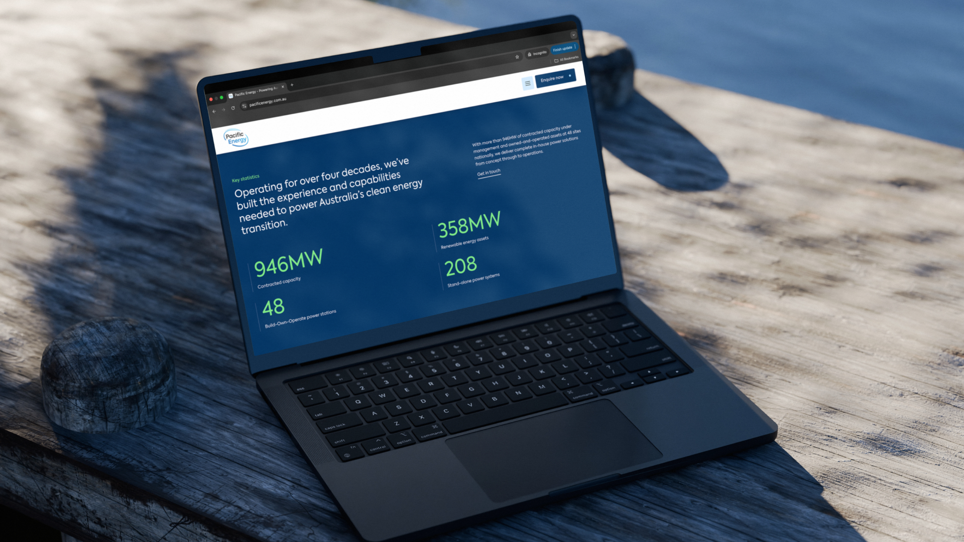 MacBook laptop showing a Pacific Energy digital dashboard or website design