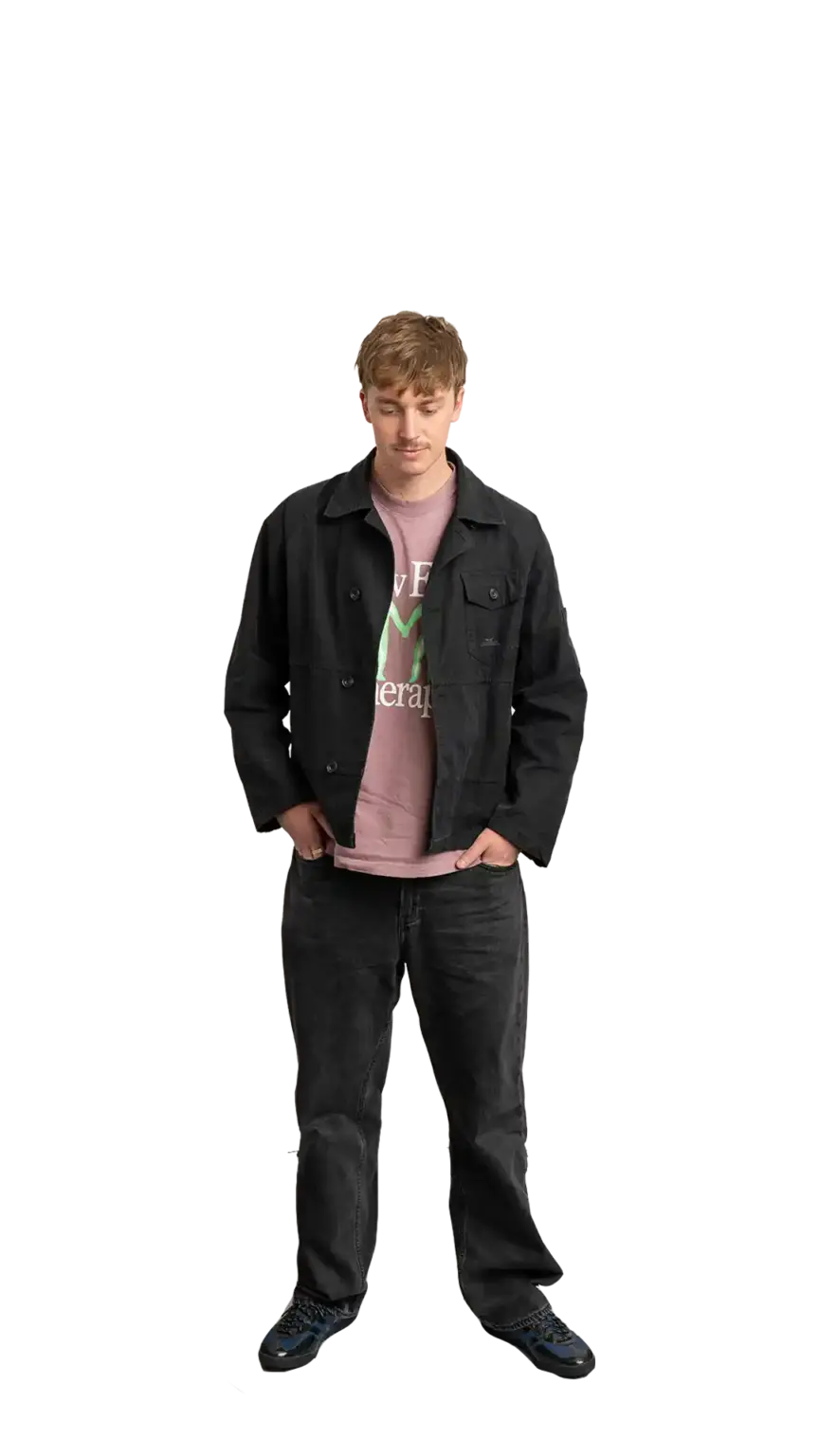 Adam Langridge, Marketing Specialist at The Start, full-body portrait — looking straight down