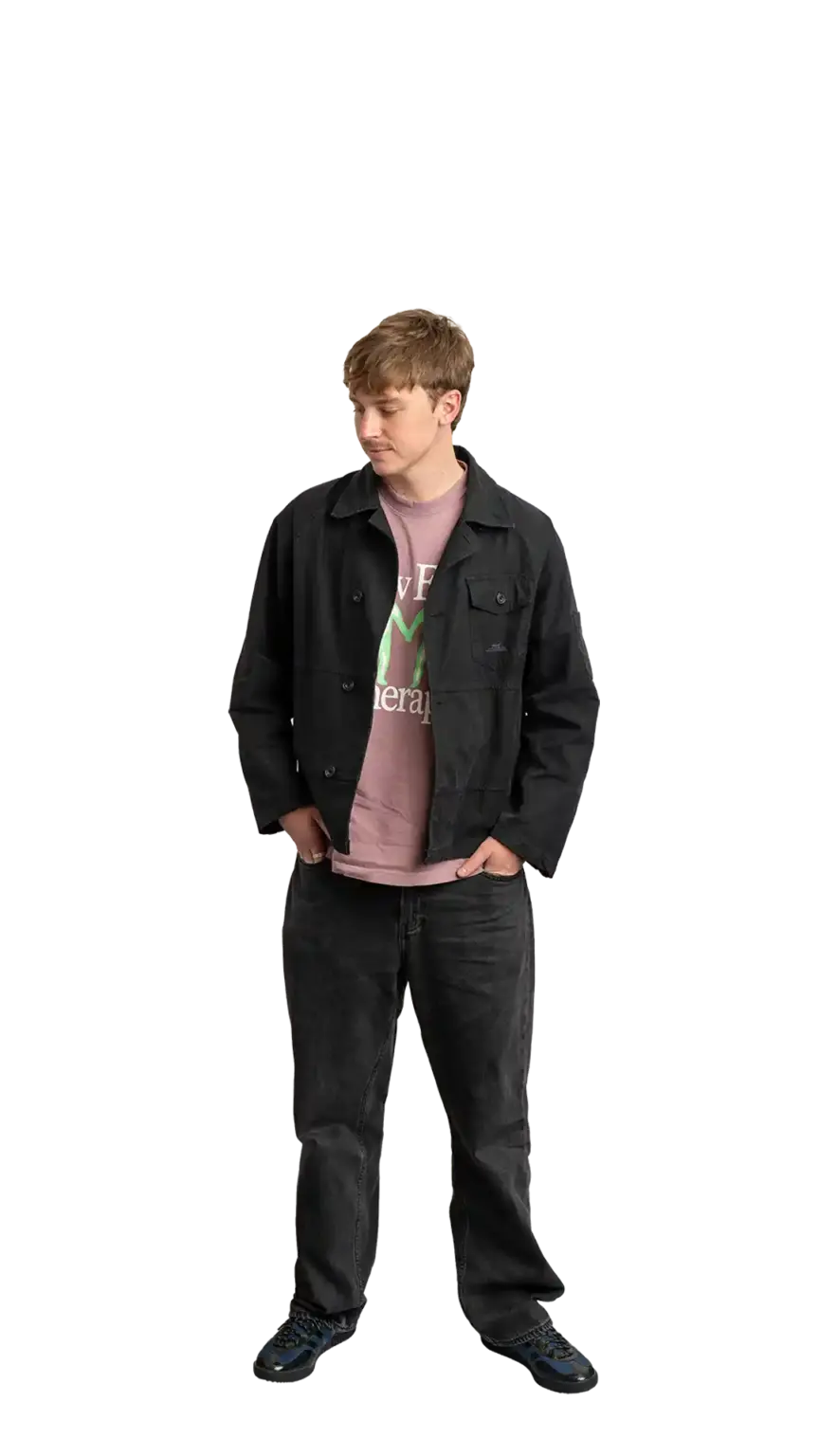 Adam Langridge, Marketing Specialist at The Start, full-body portrait — looking down and to the left
