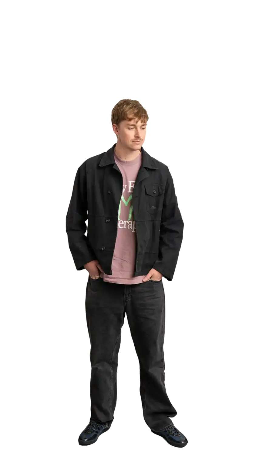 Adam Langridge, Marketing Specialist at The Start, full-body portrait — looking down and to the right
