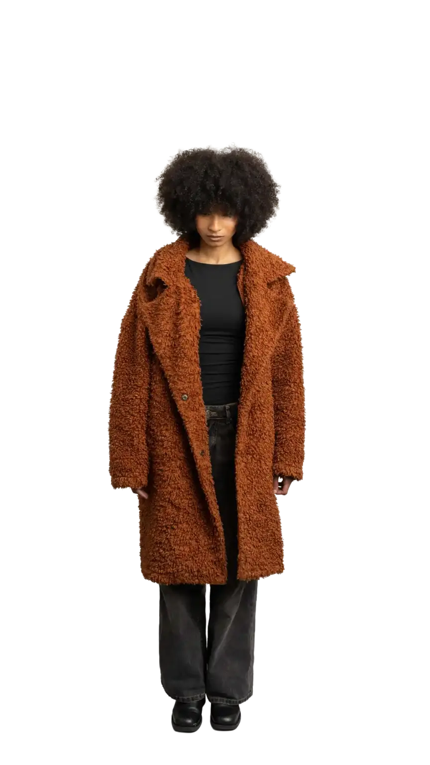 Aisha Runowanda, Creative Designer at The Start, full-body portrait — looking straight down