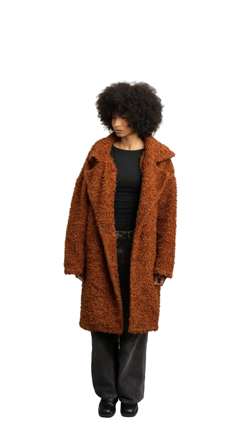 Aisha Runowanda, Creative Designer at The Start, full-body portrait — looking down and to the left