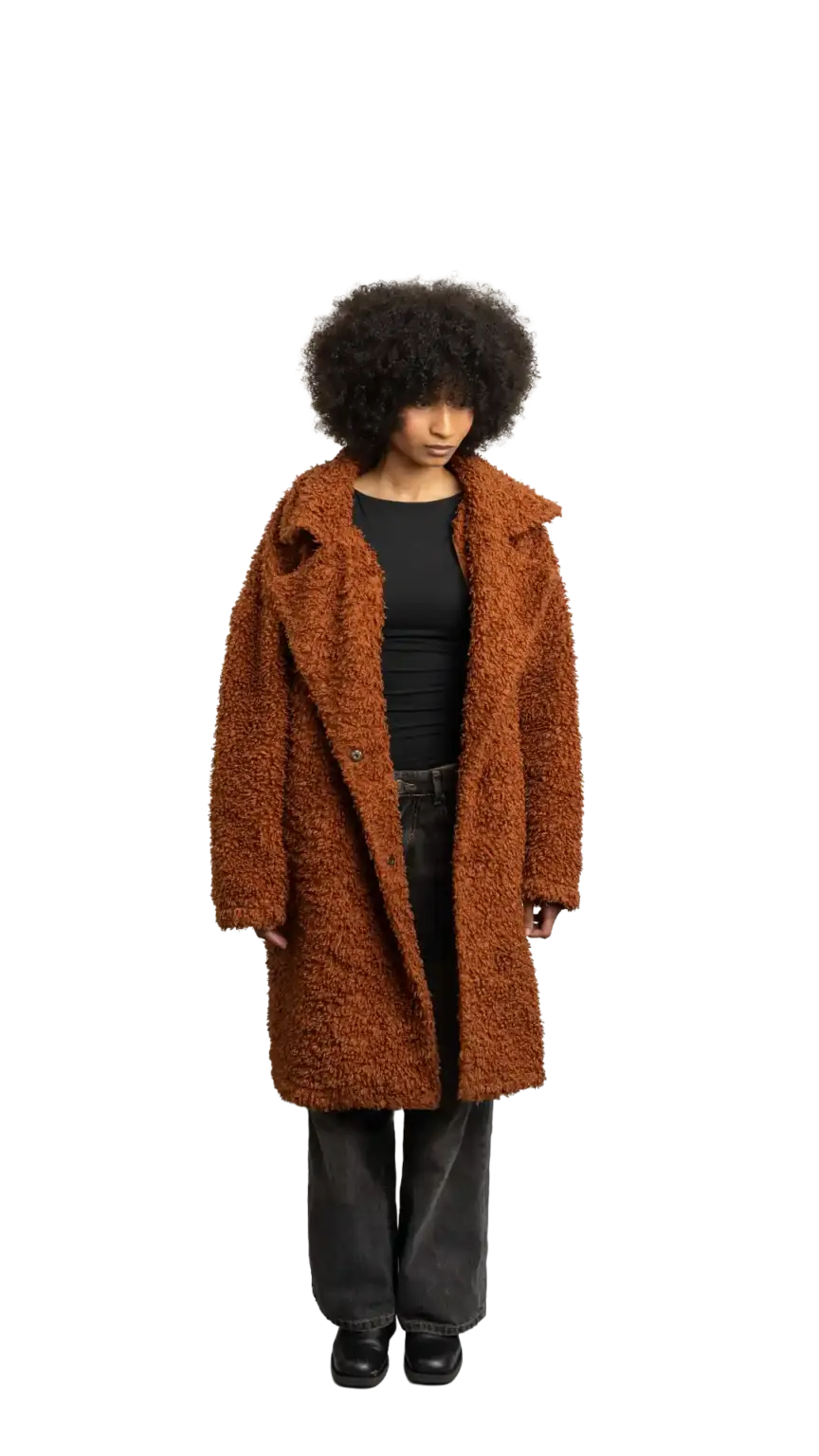 Aisha Runowanda, Creative Designer at The Start, full-body portrait — looking down and to the right