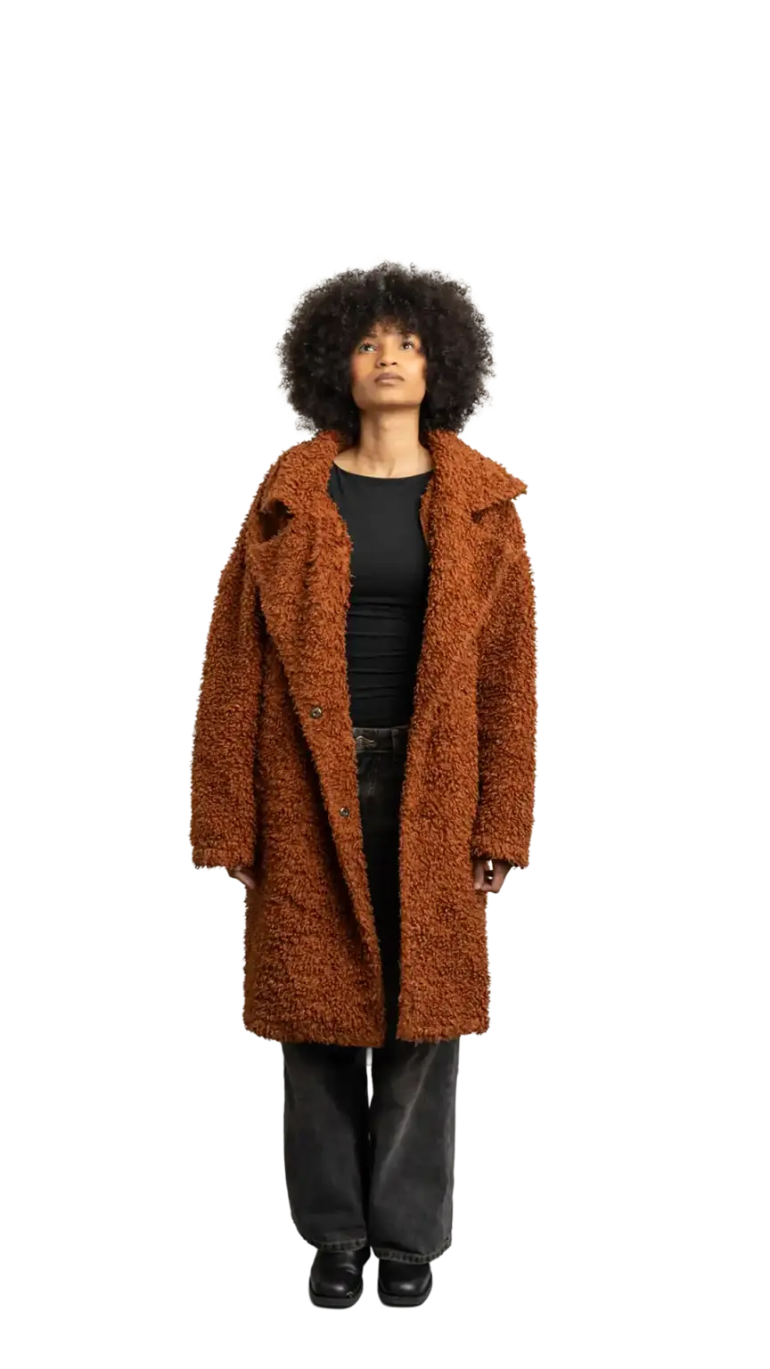Aisha Runowanda, Creative Designer at The Start, full-body portrait — looking straight up