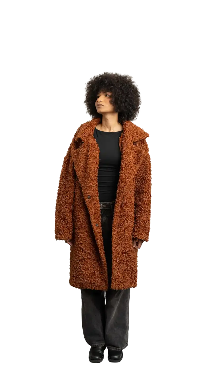 Aisha Runowanda, Creative Designer at The Start, full-body portrait — looking up and to the left