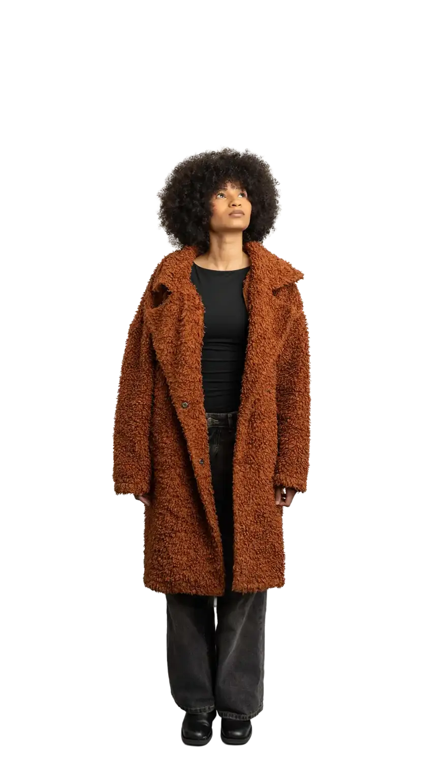 Aisha Runowanda, Creative Designer at The Start, full-body portrait — looking up and to the right