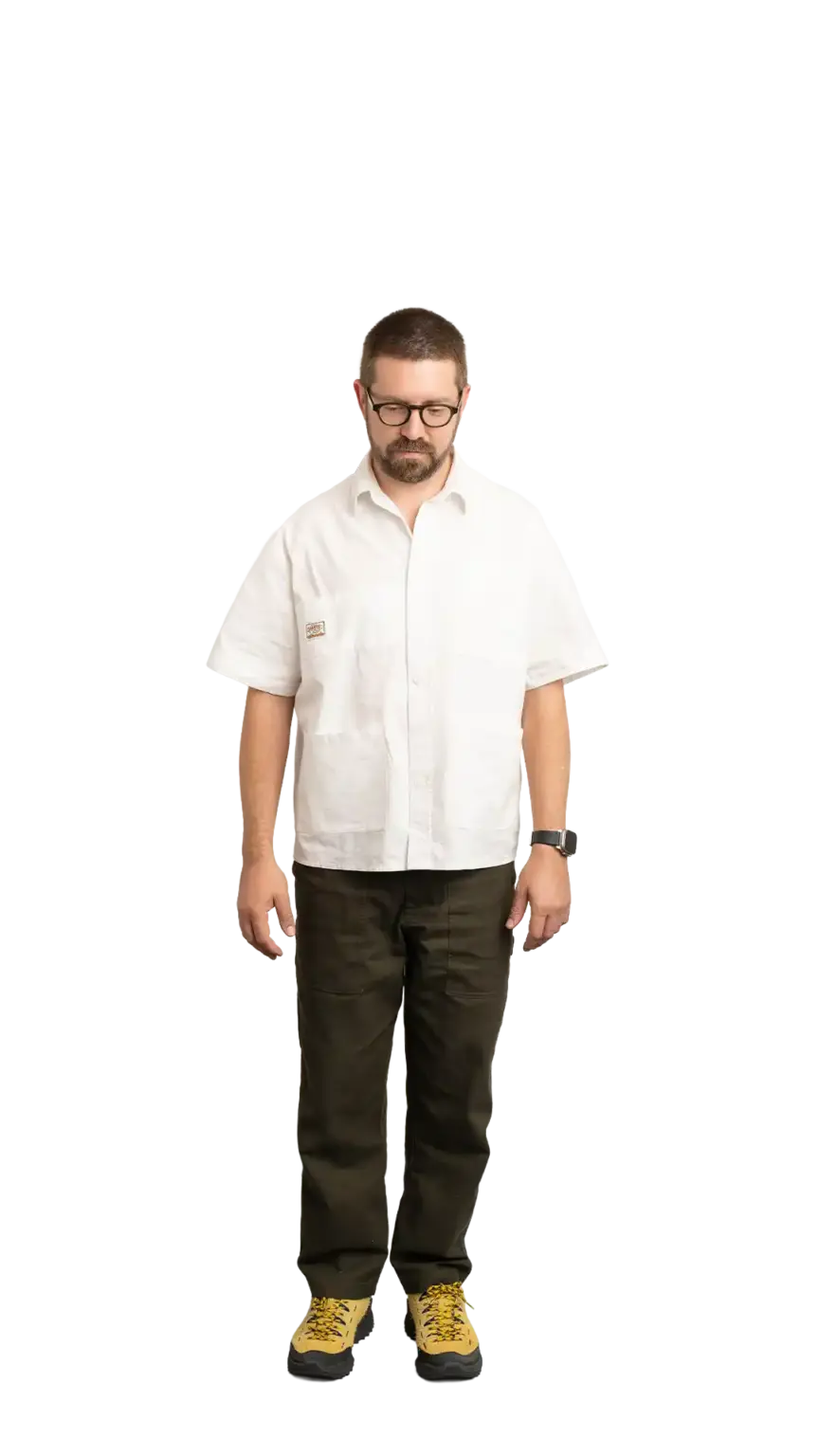Clinton Sutherland, Creative Director at The Start, full-body portrait — looking straight down