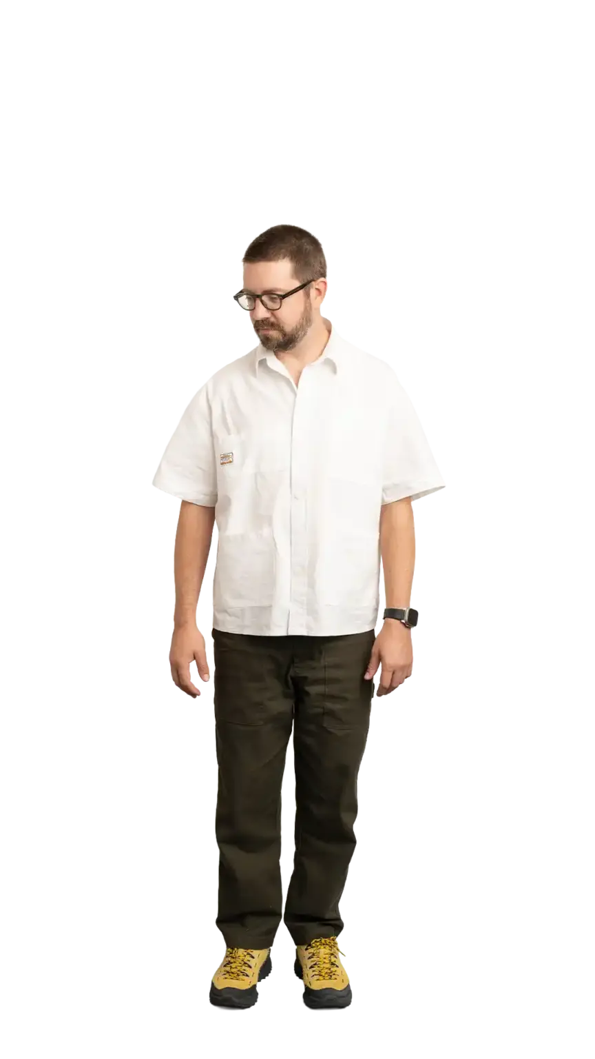 Clinton Sutherland, Creative Director at The Start, full-body portrait — looking down and to the left