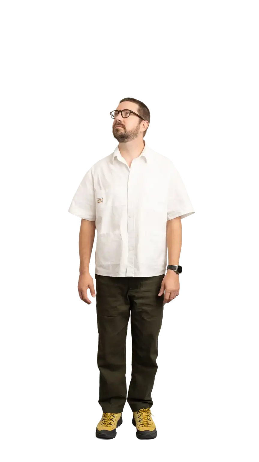 Clinton Sutherland, Creative Director at The Start, full-body portrait — looking up and to the left
