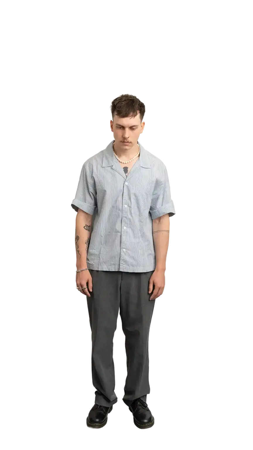 Cullen Webber, Technical Lead at The Start, full-body portrait — looking straight down