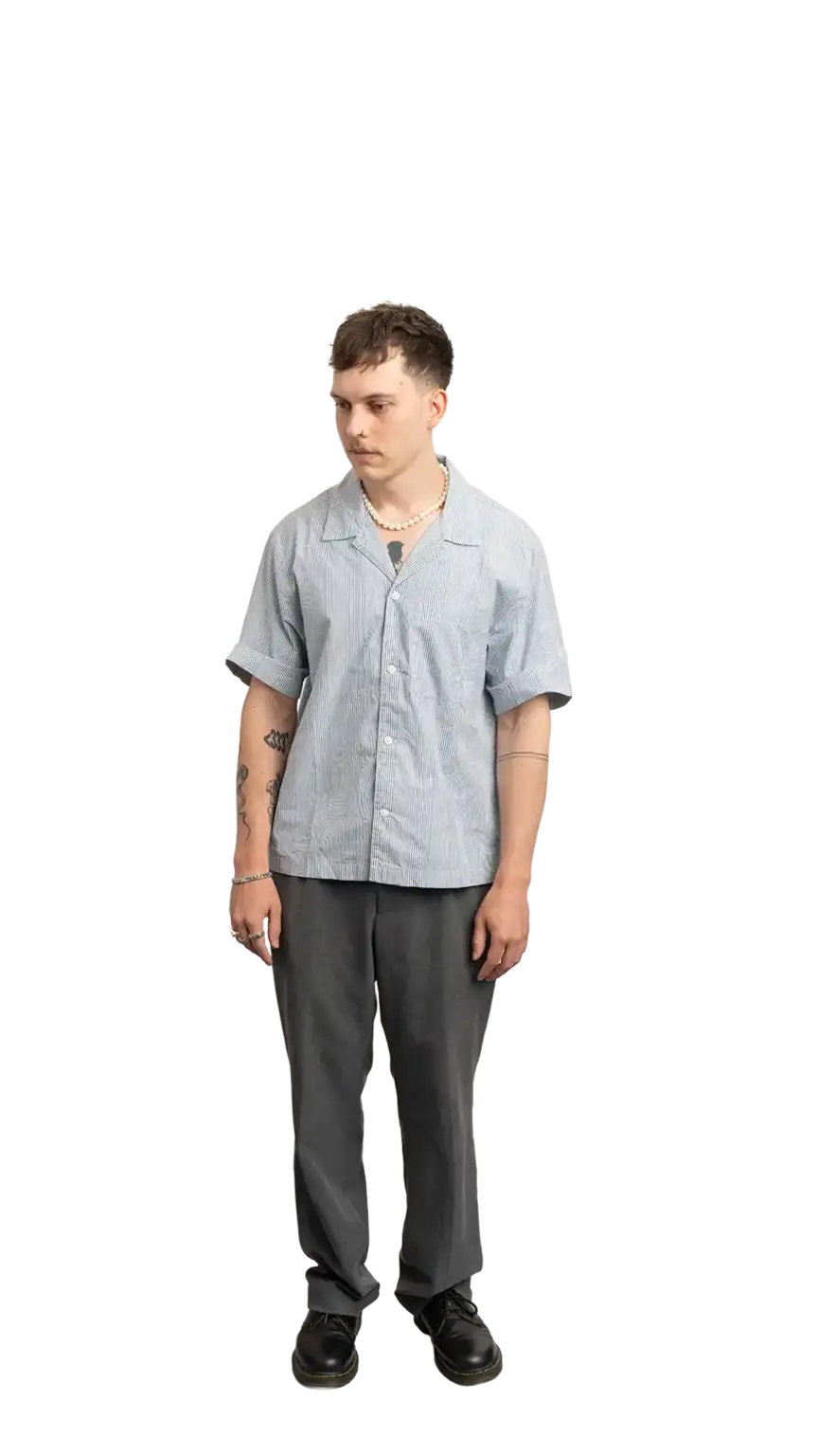 Cullen Webber, Technical Lead at The Start, full-body portrait — looking down and to the left