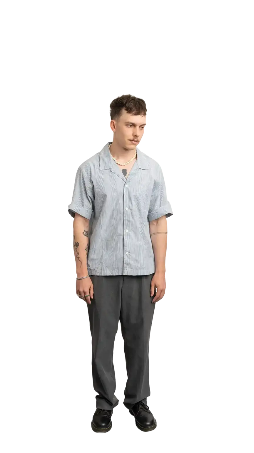 Cullen Webber, Technical Lead at The Start, full-body portrait — looking down and to the right