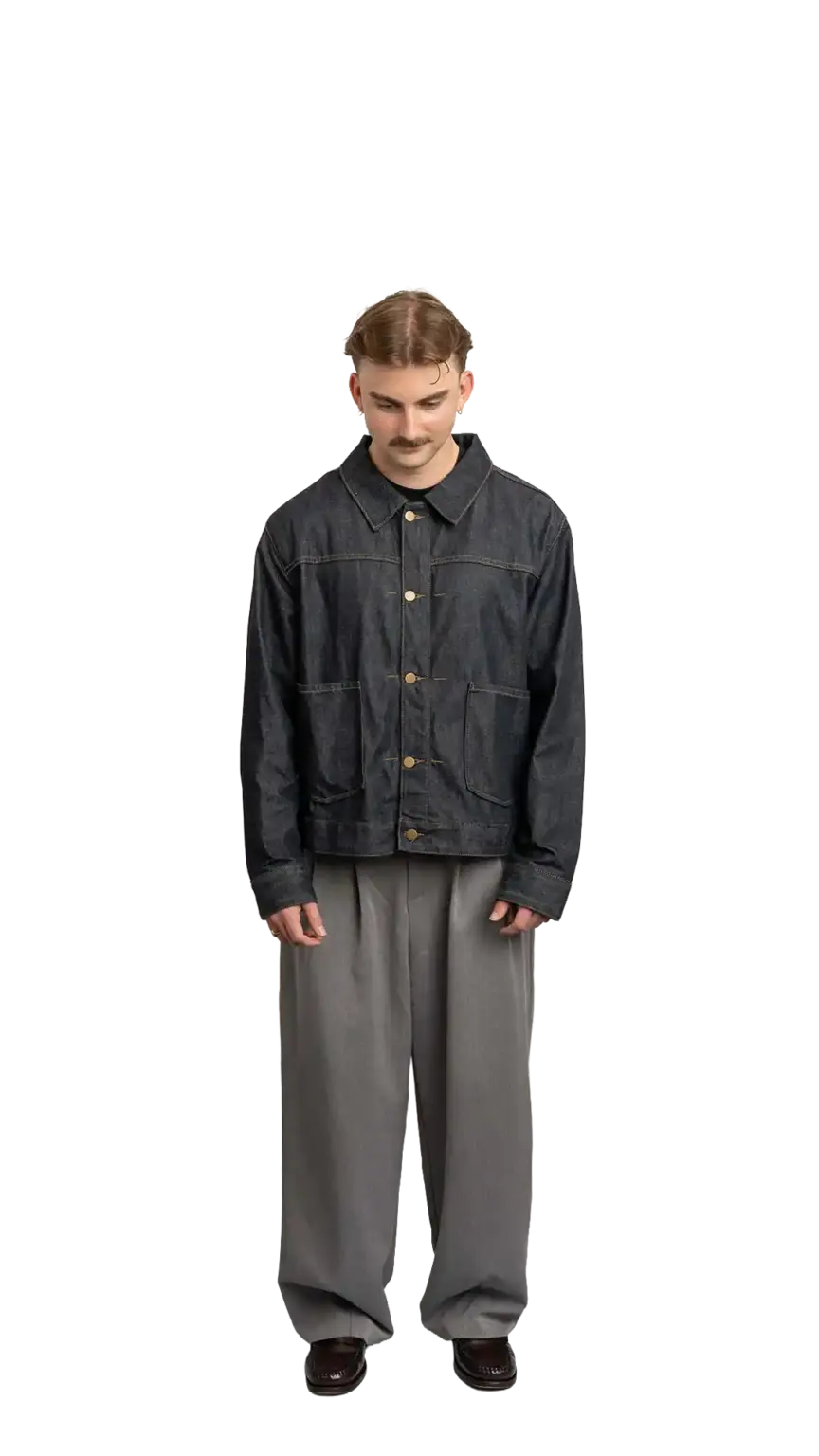 Fin Mason, Operations Manager at The Start, full-body portrait — looking straight down