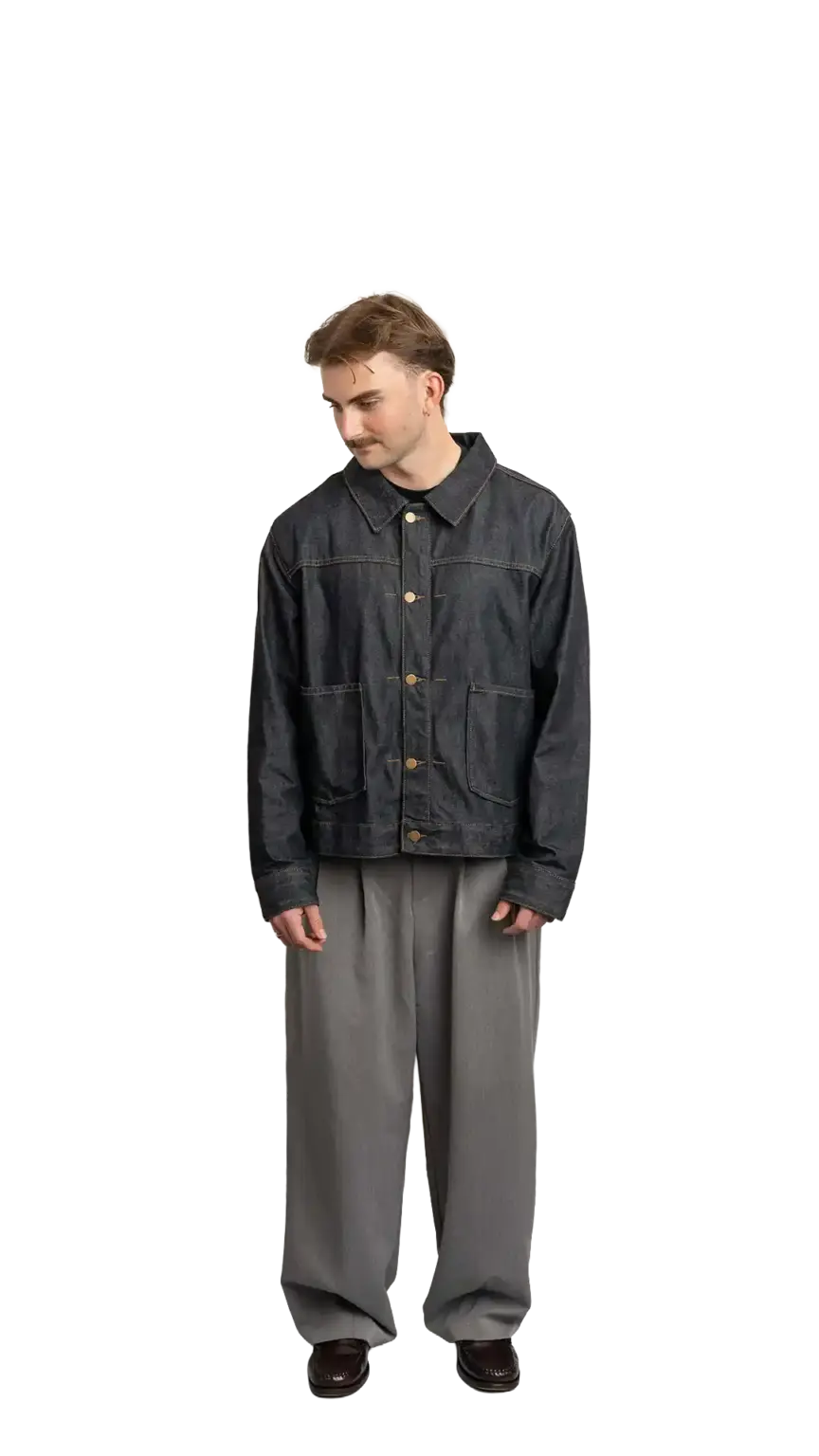 Fin Mason, Operations Manager at The Start, full-body portrait — looking down and to the left