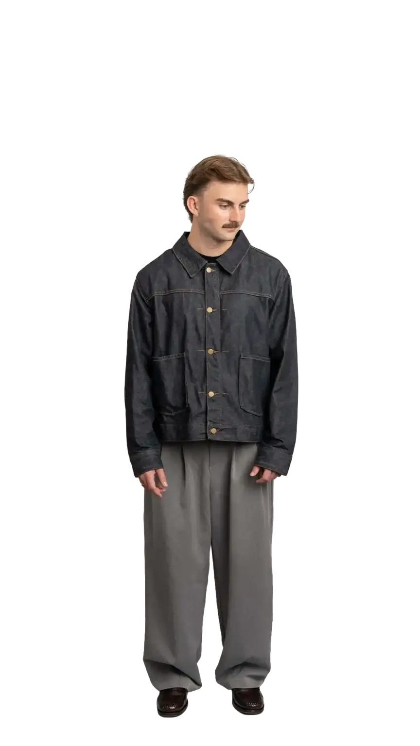 Fin Mason, Operations Manager at The Start, full-body portrait — looking down and to the right