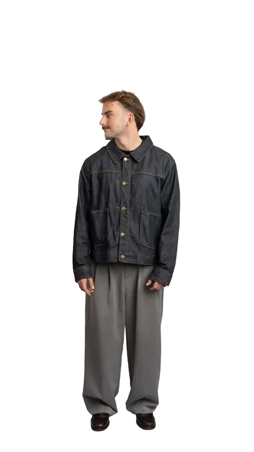 Fin Mason, Operations Manager at The Start, full-body portrait — looking to the left