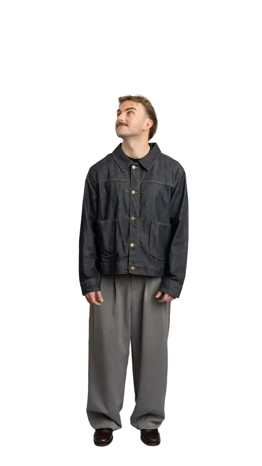 Fin Mason, Operations Manager at The Start, full-body portrait — looking up and to the left