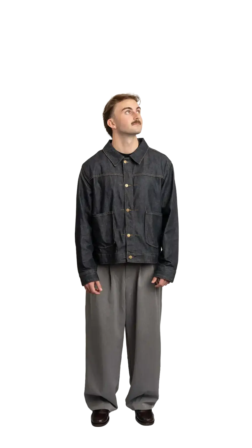 Fin Mason, Operations Manager at The Start, full-body portrait — looking up and to the right