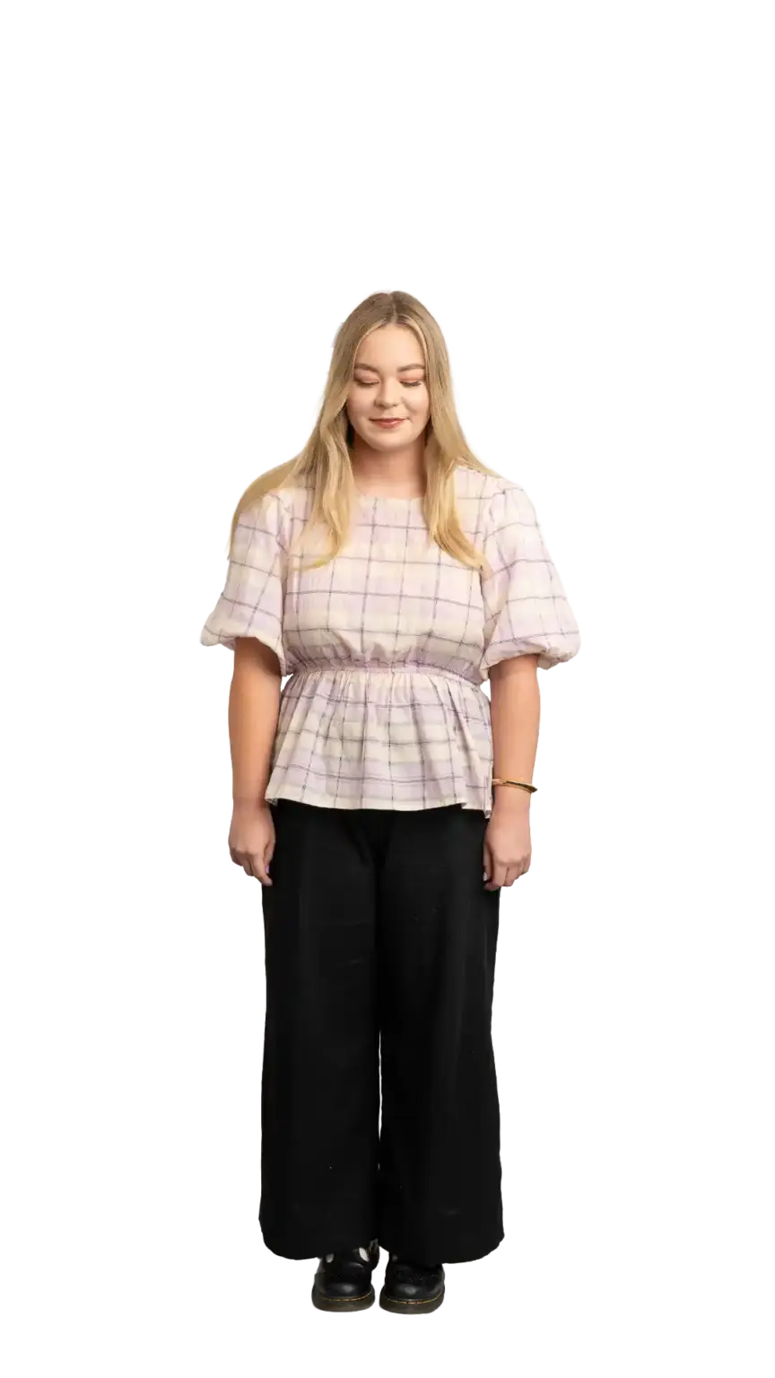 Indi Calvert, Creative Designer at The Start, full-body portrait — looking straight down