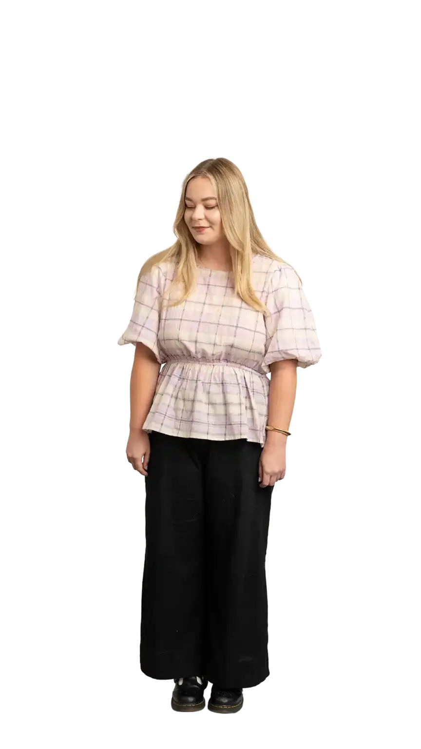 Indi Calvert, Creative Designer at The Start, full-body portrait — looking down and to the left