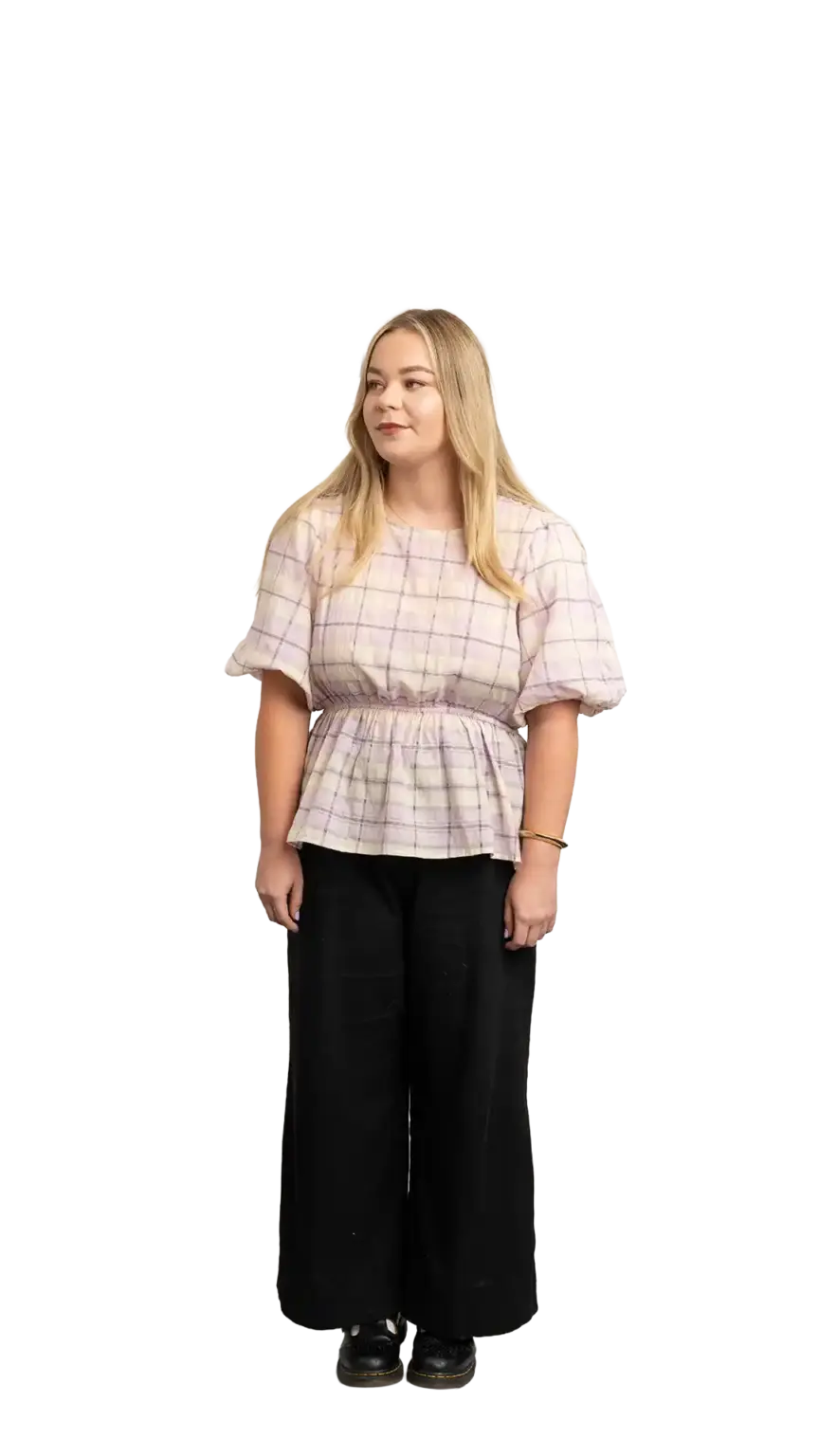 Indi Calvert, Creative Designer at The Start, full-body portrait — looking to the left