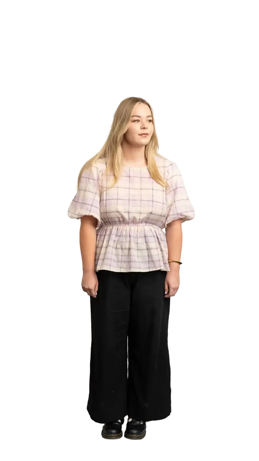 Indi Calvert, Creative Designer at The Start, full-body portrait — looking to the right