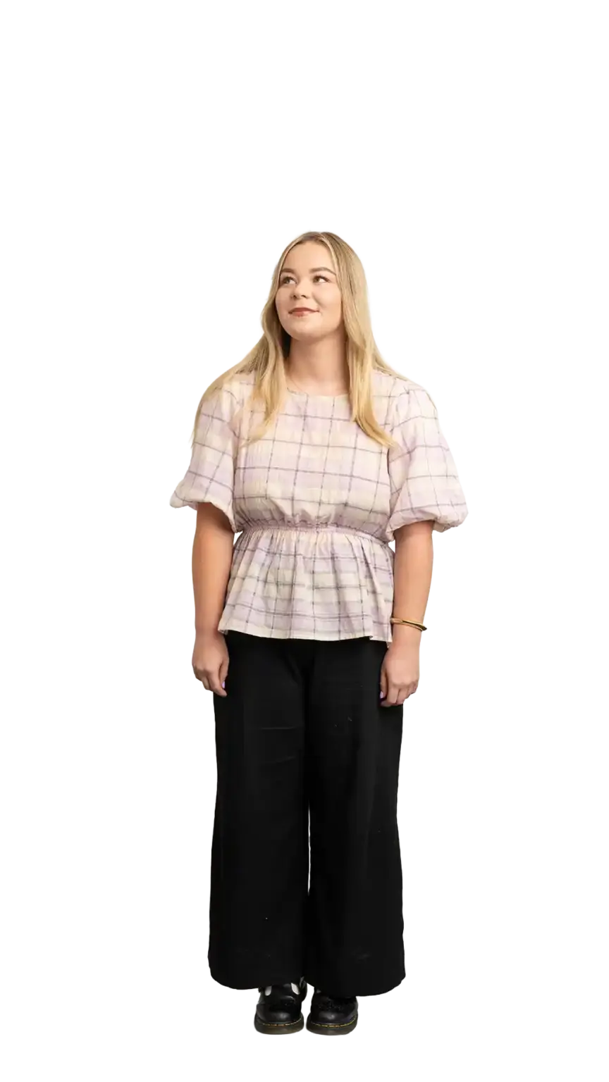 Indi Calvert, Creative Designer at The Start, full-body portrait — looking up and to the left