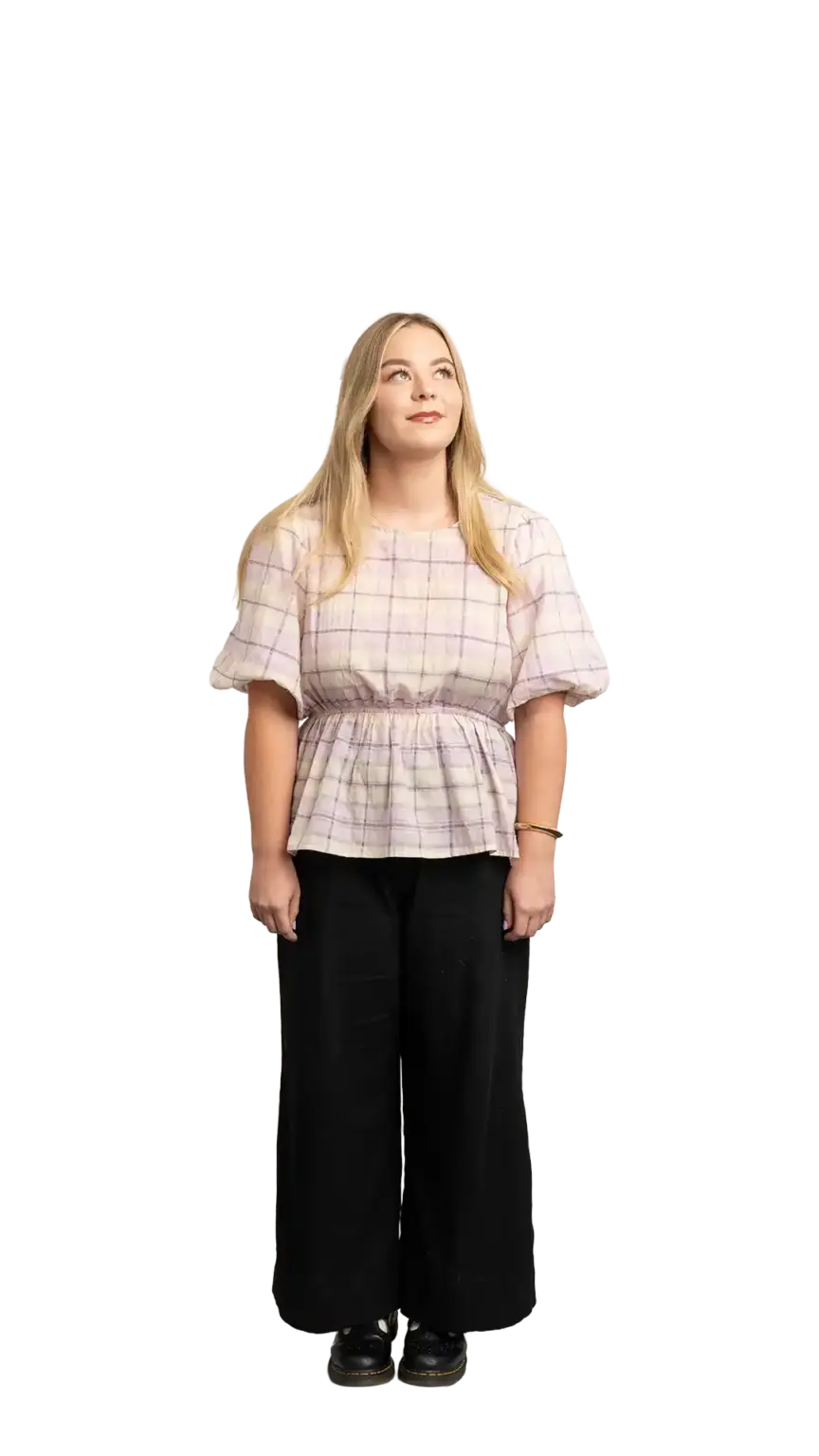 Indi Calvert, Creative Designer at The Start, full-body portrait — looking up and to the right