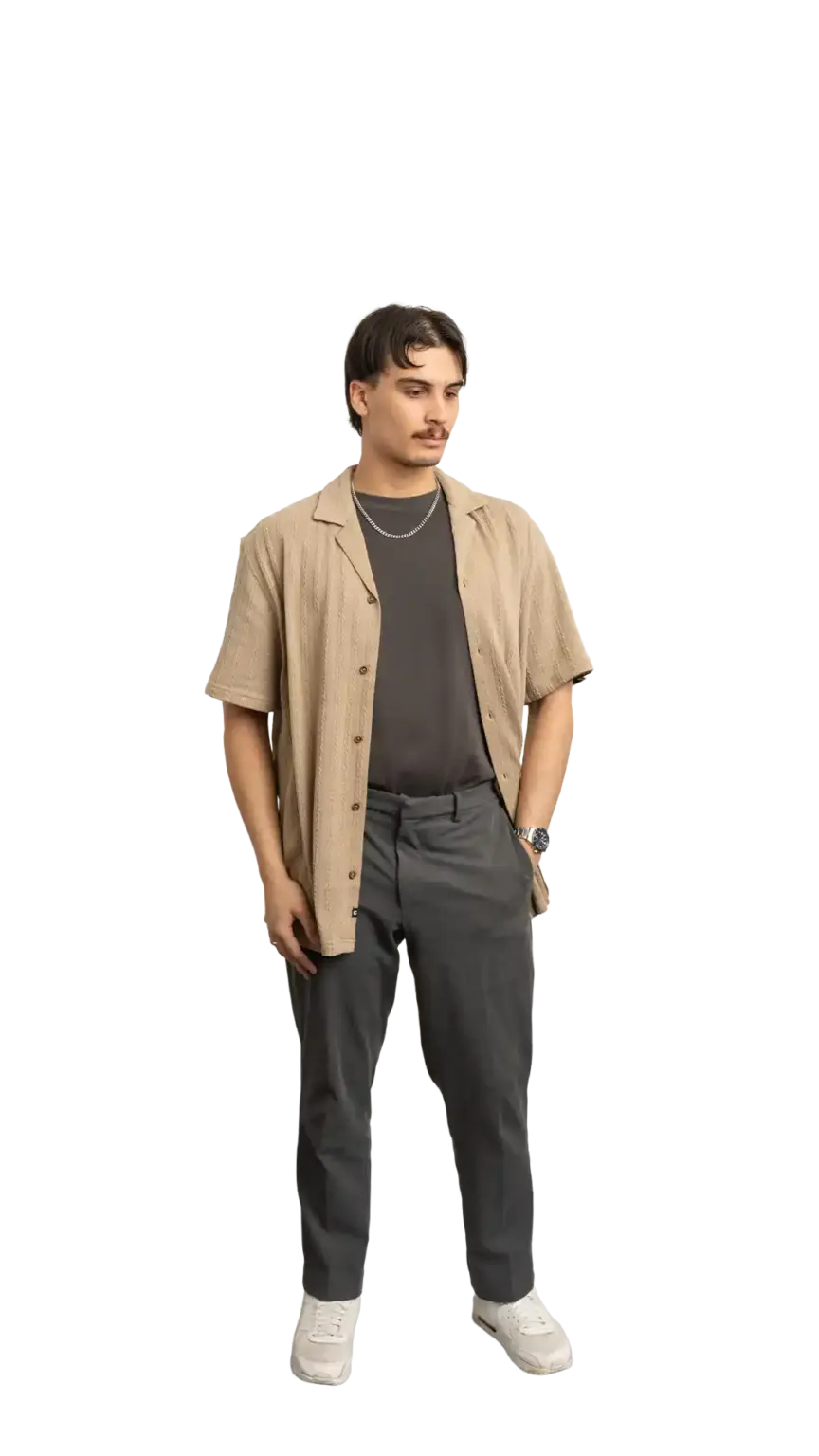 James Kang, Creative Developer at The Start, full-body portrait — looking down and to the right