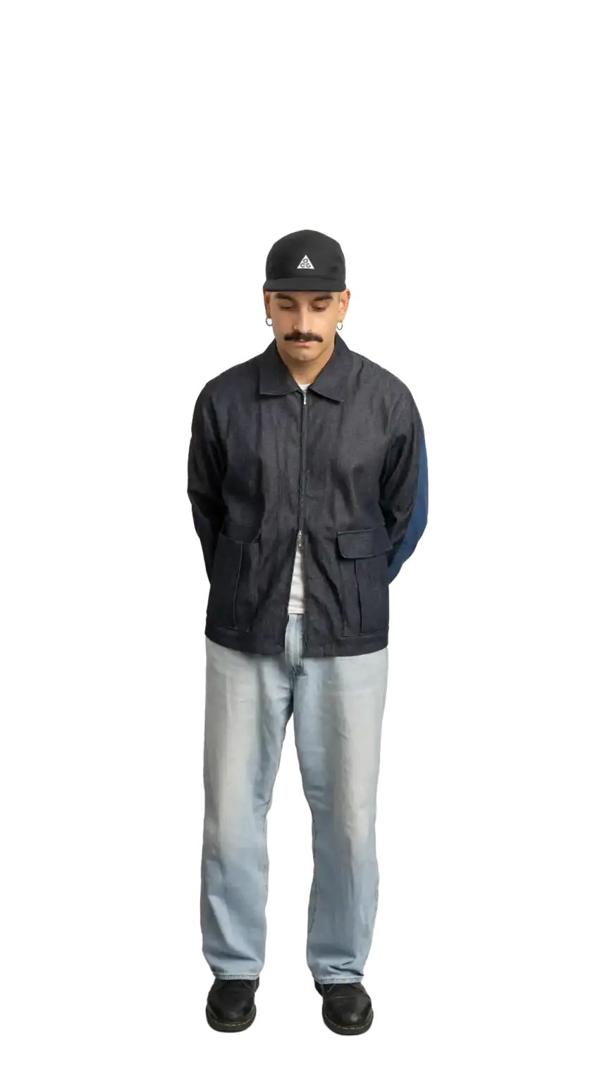 Jordan Nesic, Creative Designer at The Start, full-body portrait — looking straight down