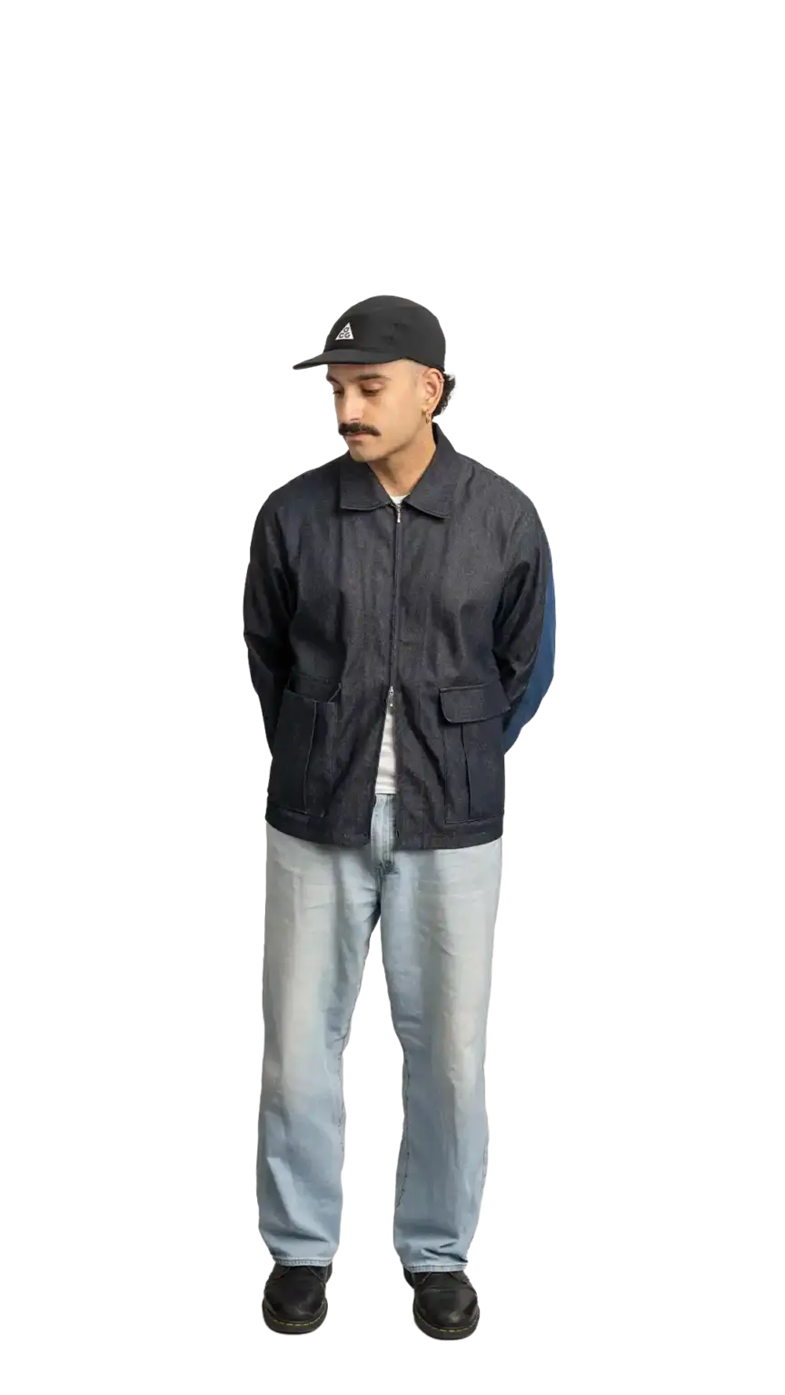 Jordan Nesic, Creative Designer at The Start, full-body portrait — looking down and to the left