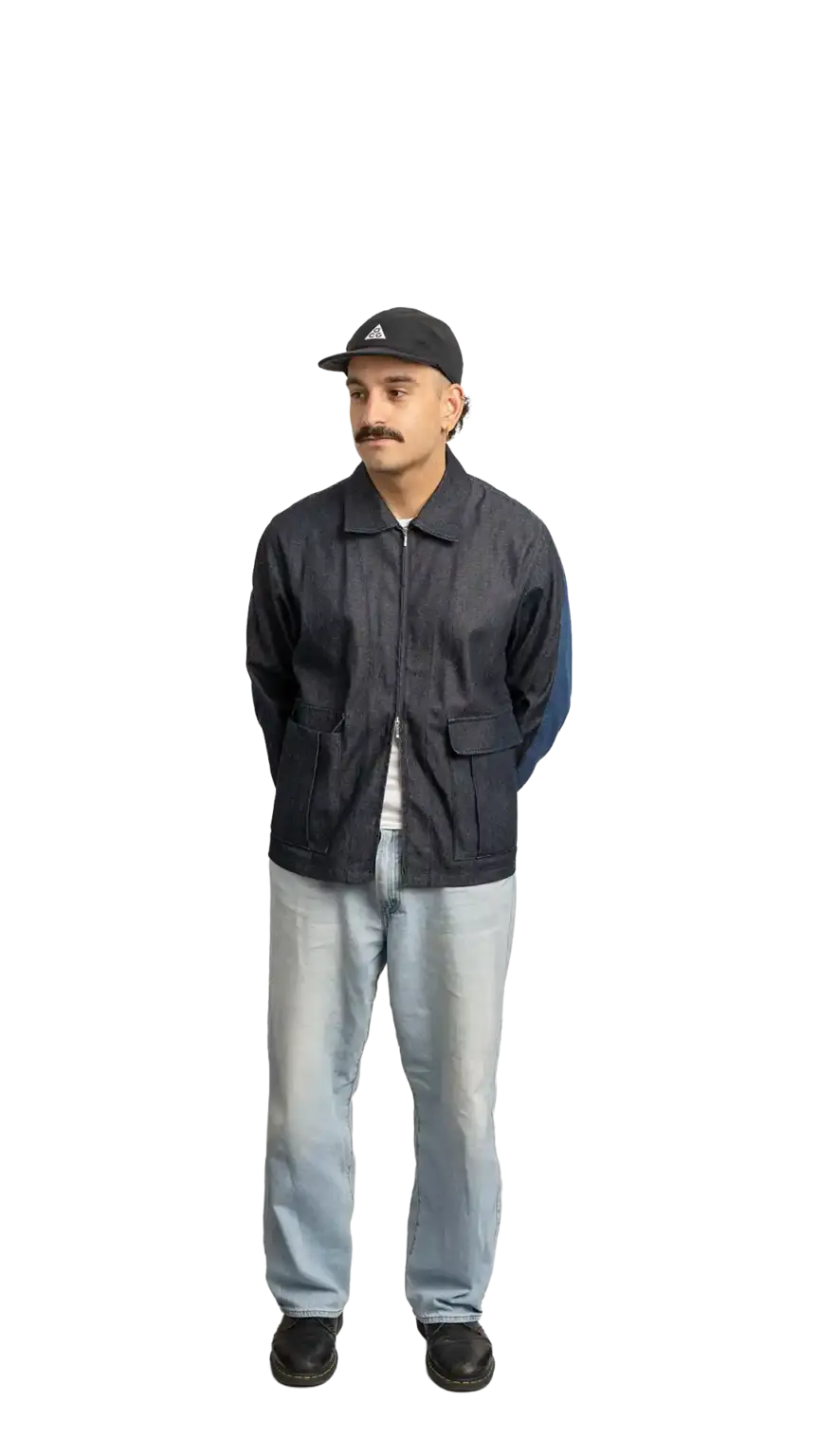 Jordan Nesic, Creative Designer at The Start, full-body portrait — looking to the left