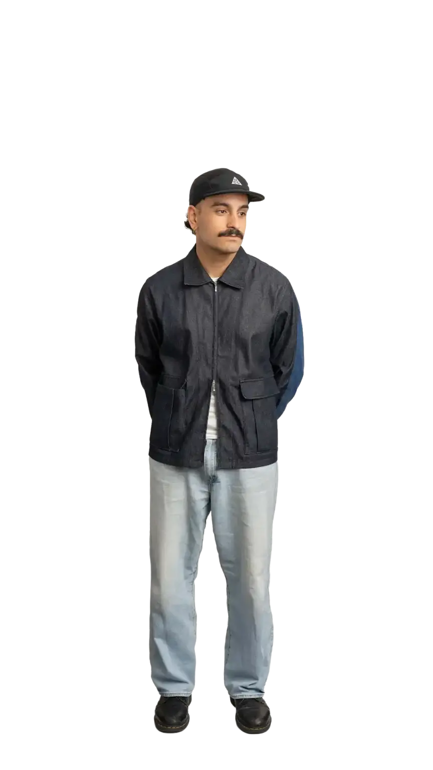 Jordan Nesic, Creative Designer at The Start, full-body portrait — looking to the right