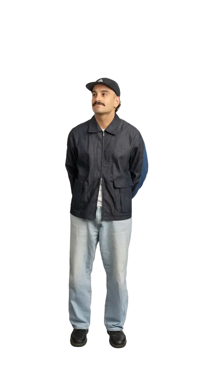 Jordan Nesic, Creative Designer at The Start, full-body portrait — looking up and to the left