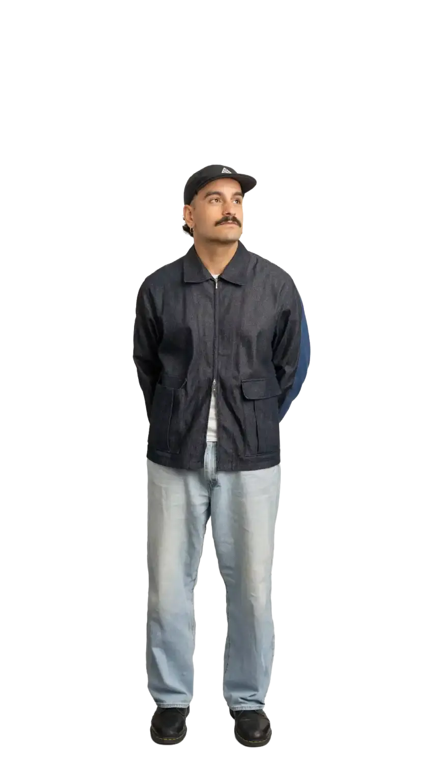 Jordan Nesic, Creative Designer at The Start, full-body portrait — looking up and to the right