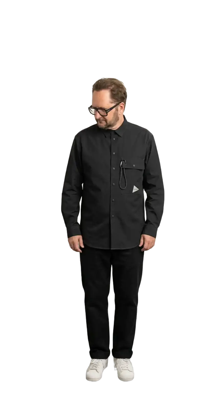 Neil Mason, Managing Director at The Start, full-body portrait — looking down and to the left