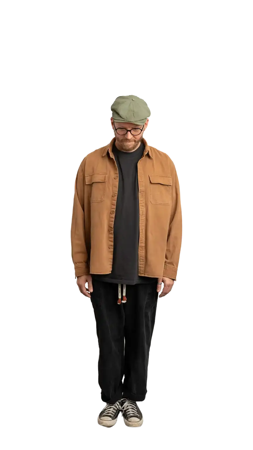 Travis Weerts, Head of Innovation at The Start, full-body portrait — looking straight down
