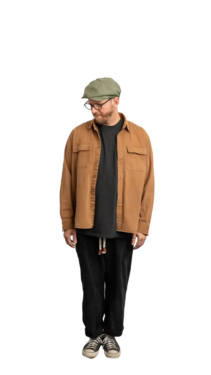 Travis Weerts, Head of Innovation at The Start, full-body portrait — looking down and to the left