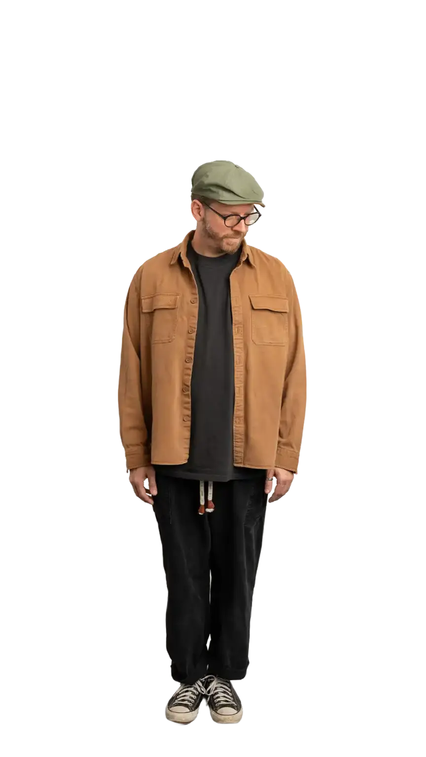 Travis Weerts, Head of Innovation at The Start, full-body portrait — looking down and to the right