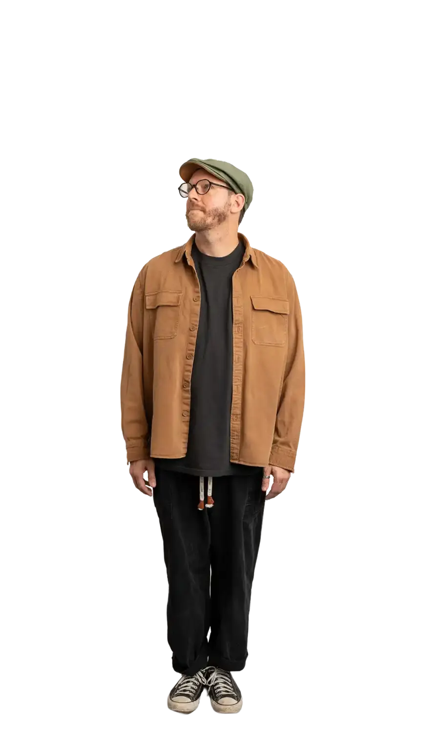 Travis Weerts, Head of Innovation at The Start, full-body portrait — looking up and to the left